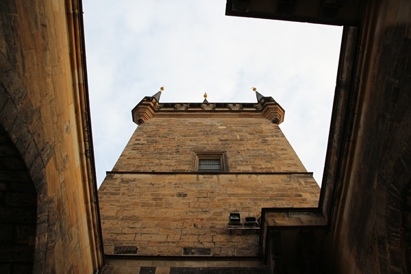 view looking up underneath the Lesser Town Bridge Tower in Prague