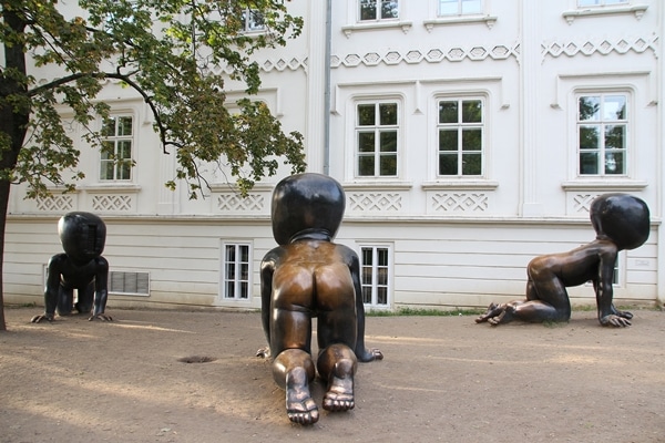 view of metal statues of crawling babies