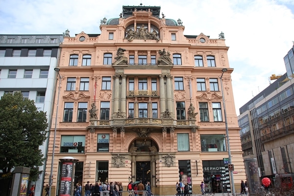 A large building with statues on the front of it