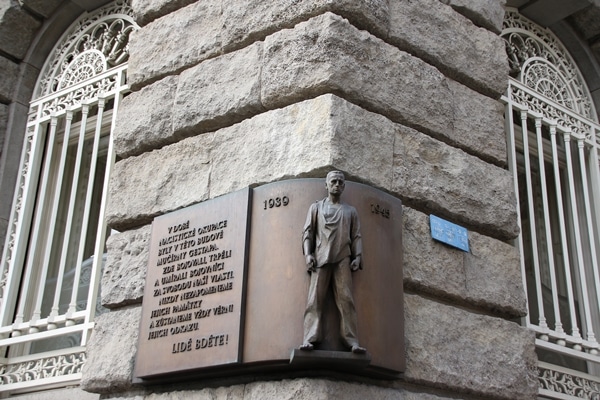 a metal plaque on a stone building