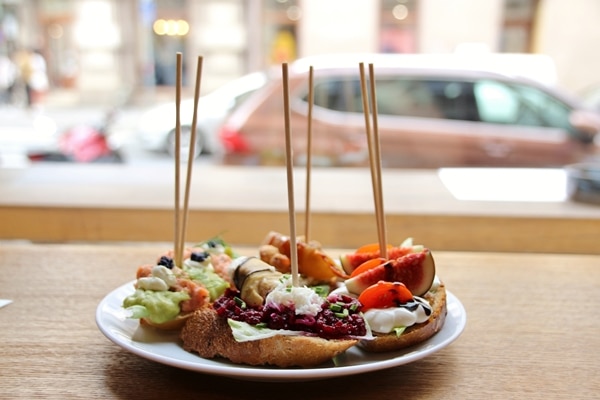 side view of sandwiches on a plate overlooking a street