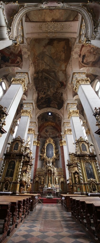 the interior of a gilded and ornate church