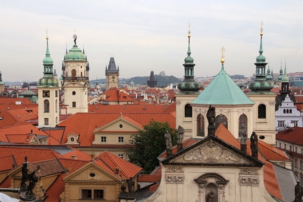 skyline of Prague with spires and red roofs