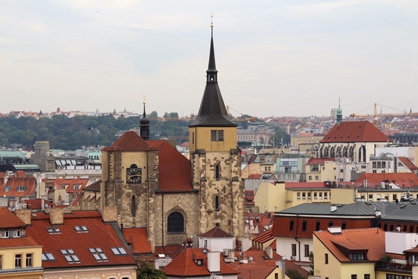 a rooftop view of various buildings including a church