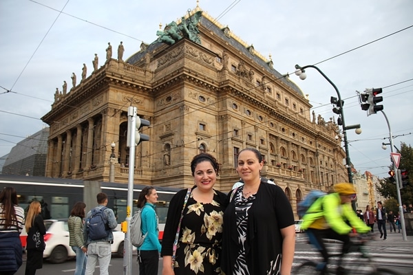 2 women in front of the National Opera building in Prague