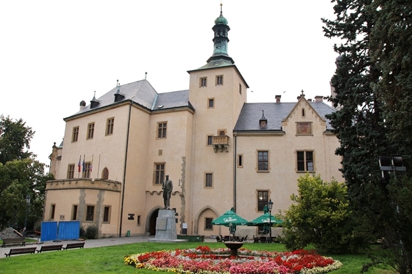 A large building with a garden in front