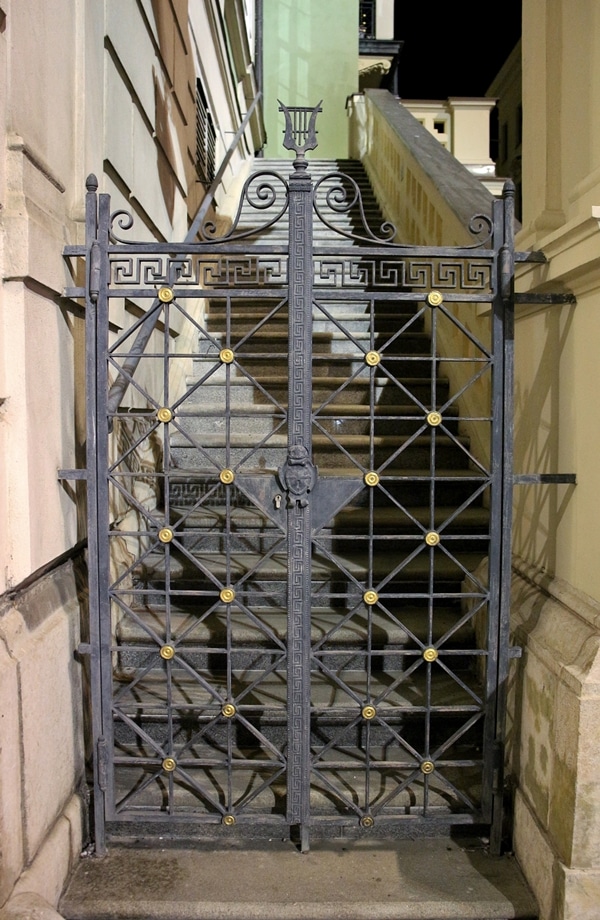 an ornate gate at night