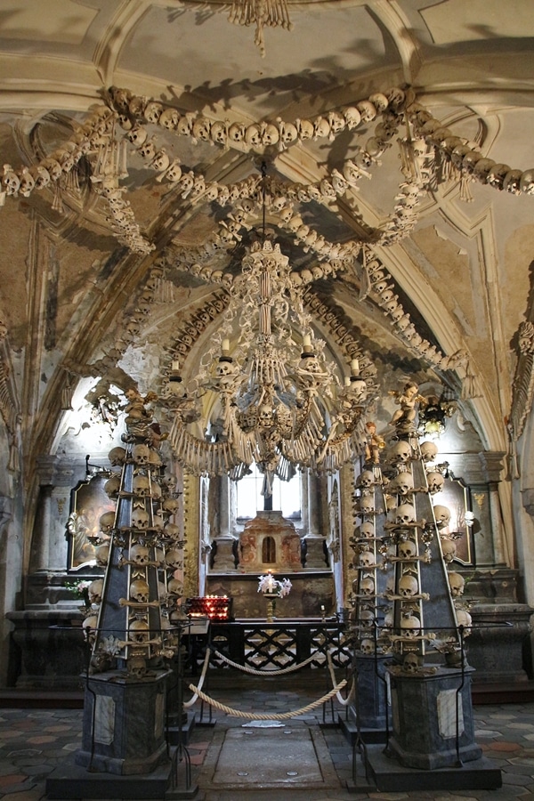 the interior of a bone church with a bone chandelier