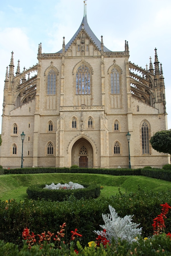 a large church with a garden in front of it