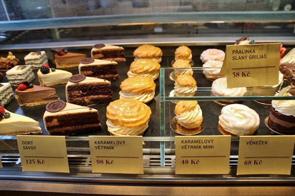 a display case in a restaurant filled with pastries