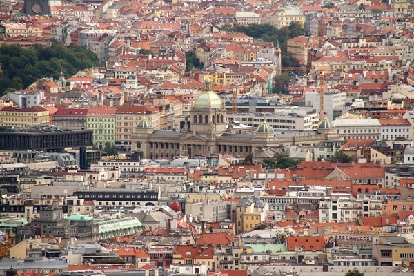 A view of Prague with large buildings in the background