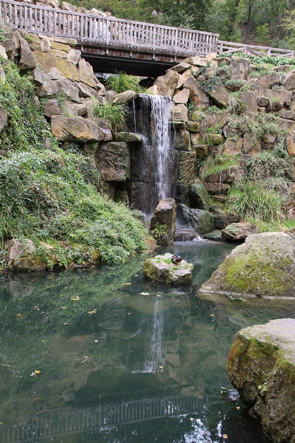 A large waterfall over a rocky cliff