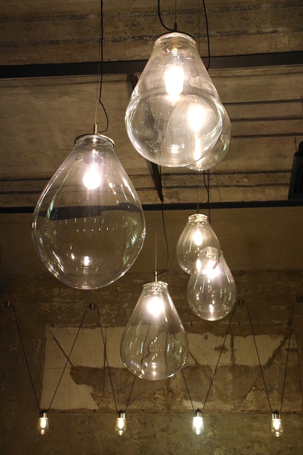 giant light bulbs hanging from a ceiling