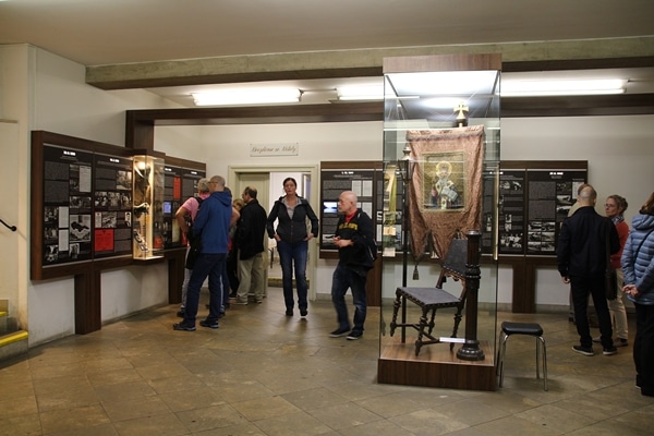 A group of people standing in a museum exhibit