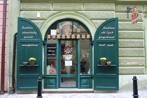 entrance to a gingerbread shop with green doors