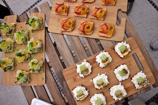 3 different varieties of open-faced sandwiches on wooden boards