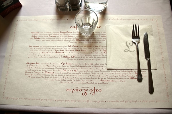 table setting in Cafe Louvre with paper placemat