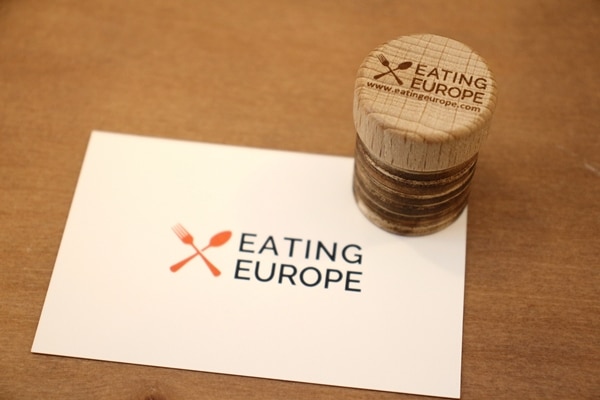 Eating Europe business card with a matching cork