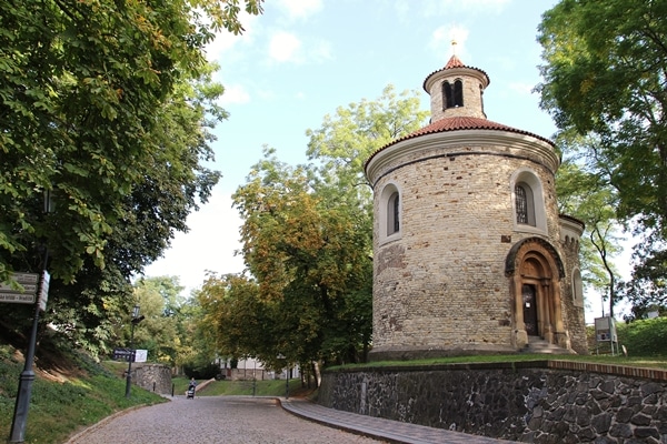 A large brick tower in a peaceful park