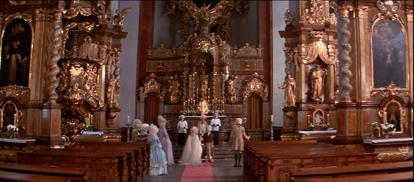 a screenshot from the movie Amadeus of a wedding in a church