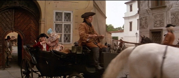 screenshot from the movie Amadeus of a horse drawn carriage