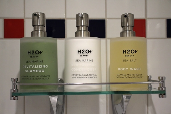 bottles of shampoo, conditioner, and body wash