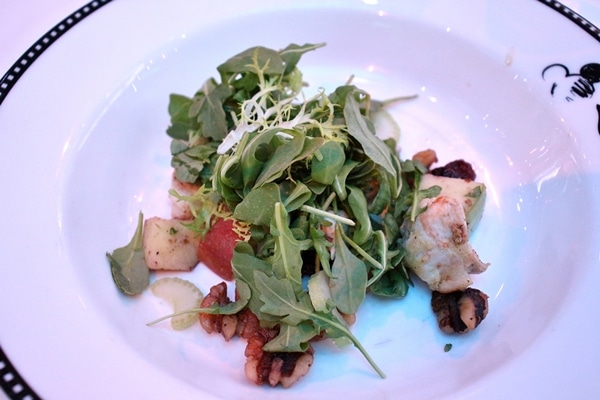 salad with walnuts on a white plate