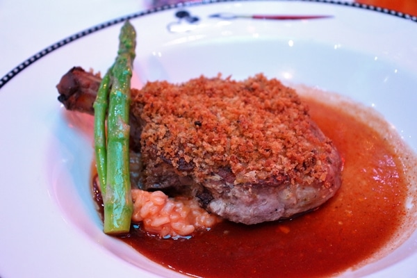 crusted meat with tomato risotto and brown sauce