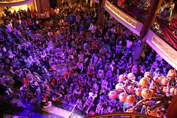 a crowd of people in the Disney Fantasy atrium