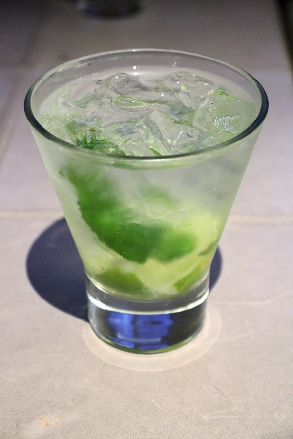 A close up of a mojito cocktail