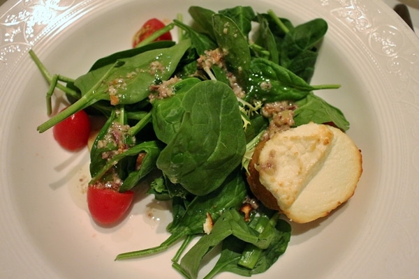 A small salad with a goat cheese toast