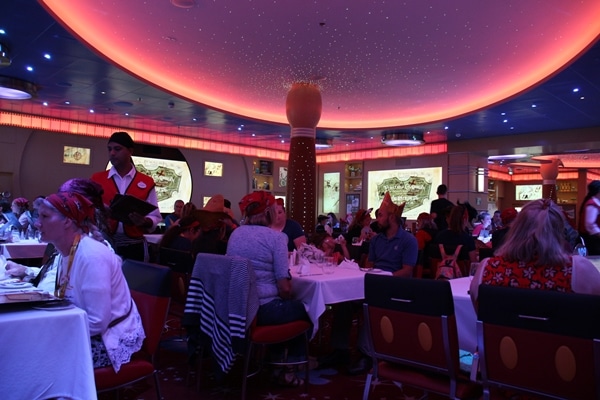 A group of people sitting at a table in a restaurant