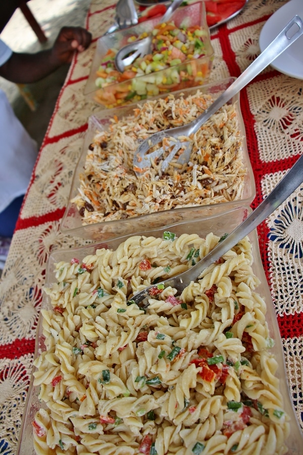 a variety of salads on a buffet line