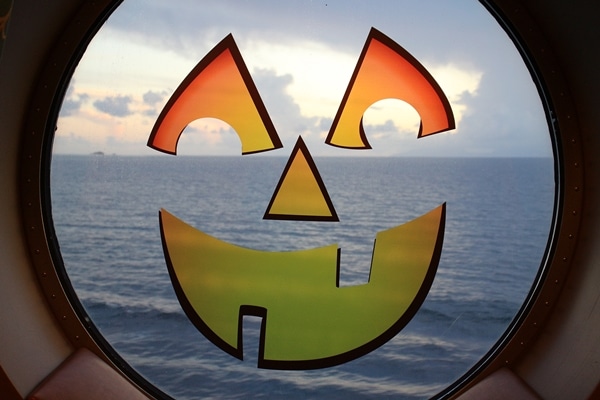 A view of a body of water through a jack-o-lantern window decal