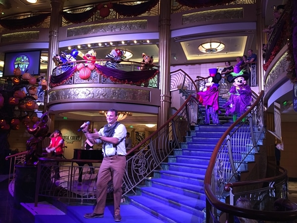 Mickey and Minnie Mouse in Halloween costumes in the Disney Fantasy atrium