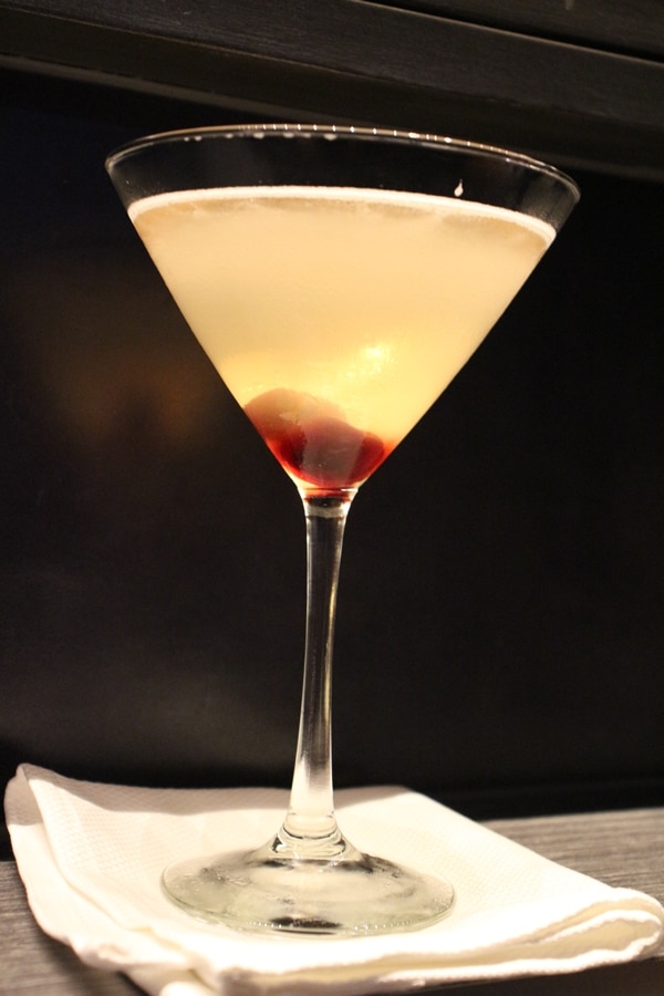 a cocktail garnished with cherries