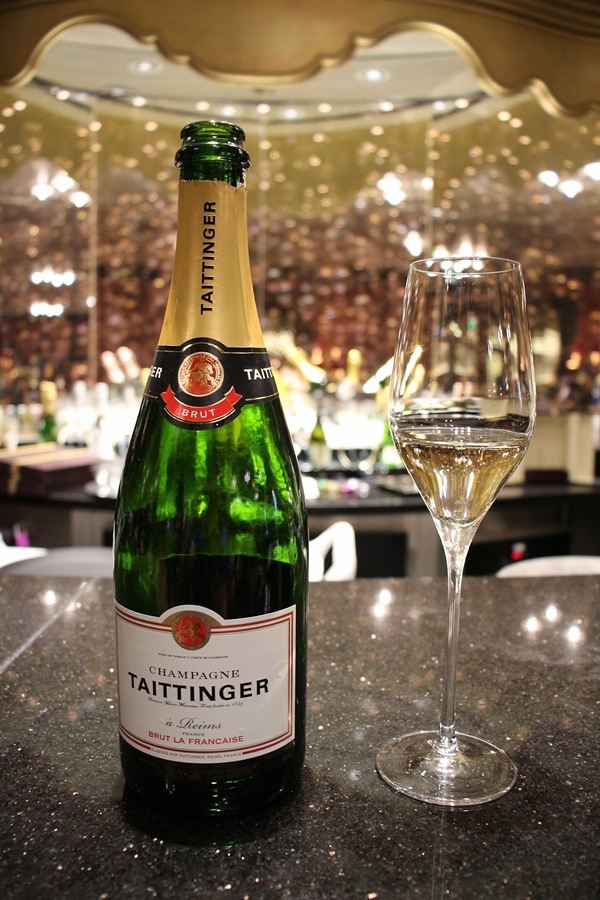 A close up of a bottle of Champagne on the bar