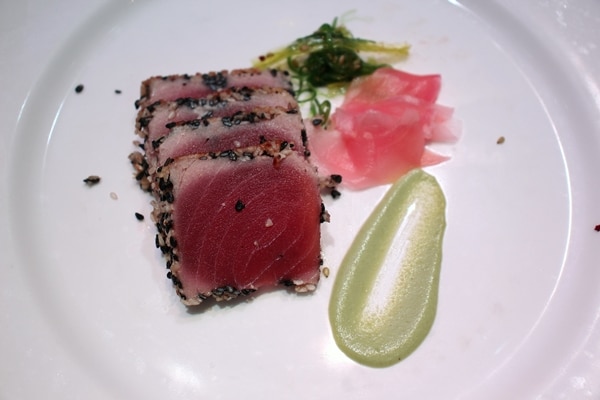 seared tuna with wasabi on a white plate