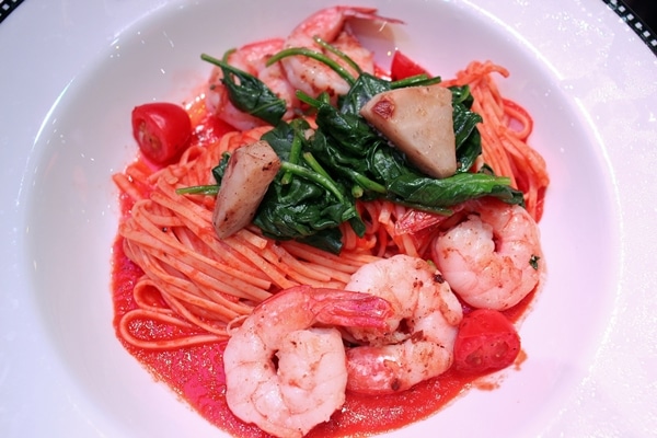 linguine with seafood and spinach in a wide bowl