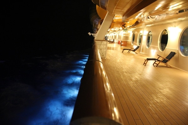 the deck of a cruise ship at night