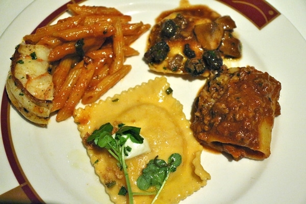 a sampling of 4 different pasta dishes on a single plate