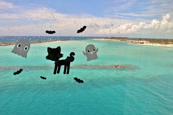 Halloween decals on a cruise ship window overlooking Castaway Cay