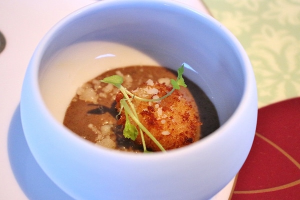 a small bowl with fried gnocchi and sauce