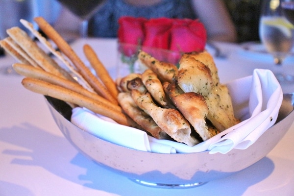 a platter of various breads and breadsticks