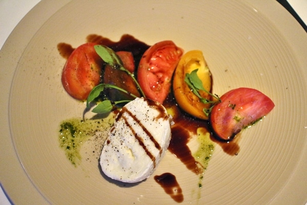 mozzarella and tomatoes with balsamic on a plate