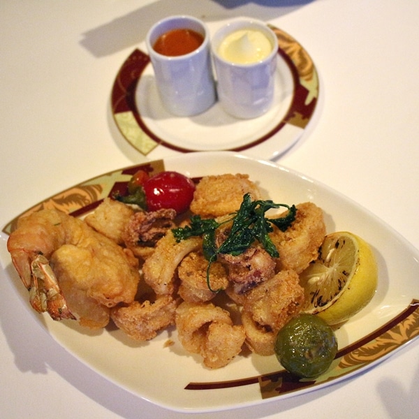 fried calamari and shrimp on an oval plate