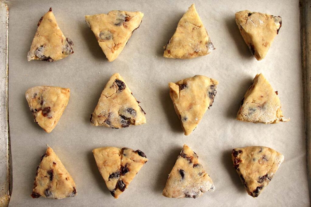 Scones arranged on a baking sheet