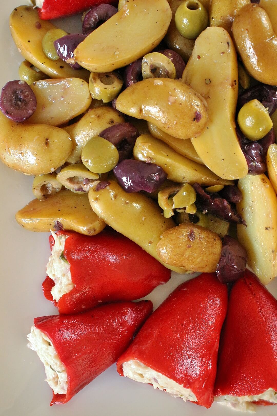 Fingerling potato and olive salad with 4 red piquillo peppers stuffed with tuna salad