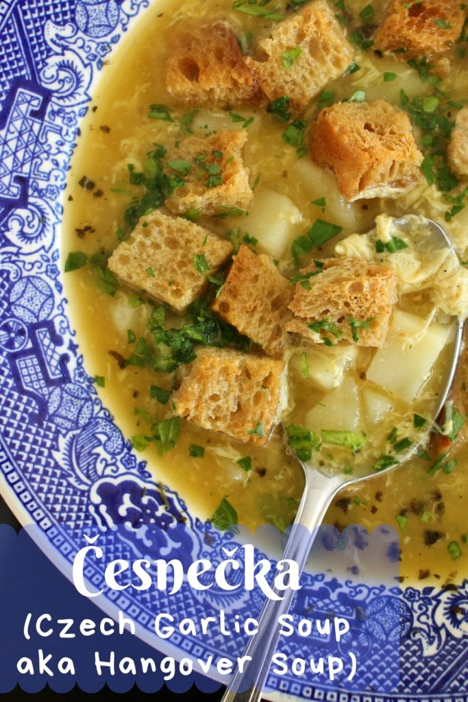 A bowl of Czech garlic soup with rye bread croutons
