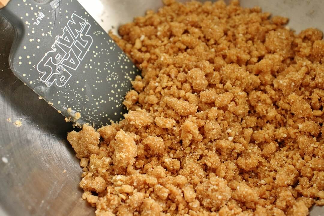 graham cracker crumble in a metal mixing bowl